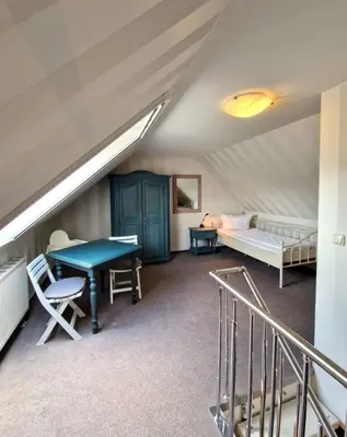 Ein Bett oder Betten in einem Zimmer der Unterkunft Darsser Weg 32a