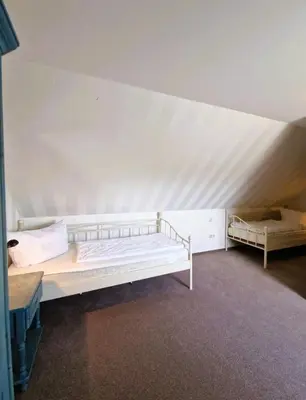 Ein Bett oder Betten in einem Zimmer der Unterkunft Darsser Weg 32a