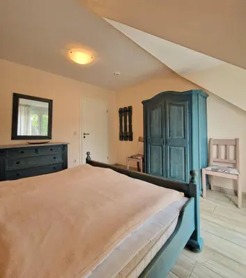 Ein Bett oder Betten in einem Zimmer der Unterkunft Darsser Weg 32a