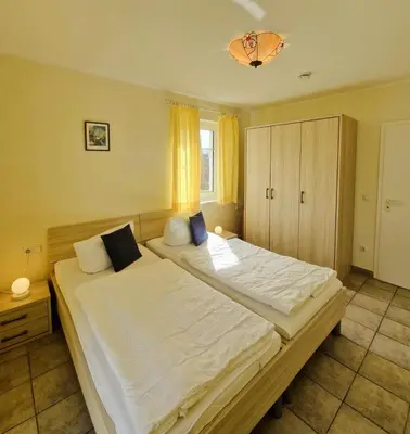 Ein Bett oder Betten in einem Zimmer der Unterkunft Darsser Weg 38