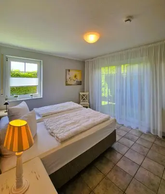 Ein Bett oder Betten in einem Zimmer der Unterkunft Darsser Weg 38 a
