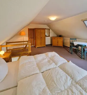 Ein Bett oder Betten in einem Zimmer der Unterkunft Darsser Weg 38