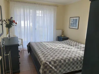 Ein Bett oder Betten in einem Zimmer der Unterkunft Darsser Weg 32
