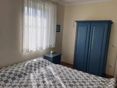 Ein Bett oder Betten in einem Zimmer der Unterkunft Darsser Weg 32
