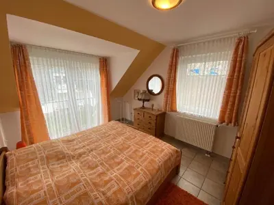 Ein Bett oder Betten in einem Zimmer der Unterkunft Darsser Weg 32