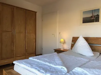 Ein Bett oder Betten in einem Zimmer der Unterkunft Darsser Weg 34 a