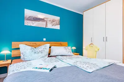 Ein Bett oder Betten in einem Zimmer der Unterkunft Darßer Weg 31a