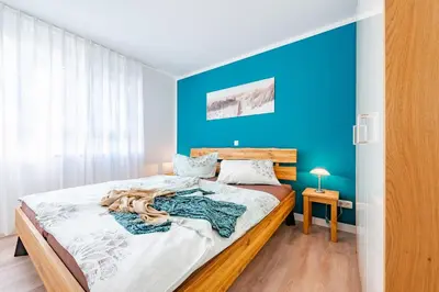Ein Bett oder Betten in einem Zimmer der Unterkunft Darßer Weg 31a