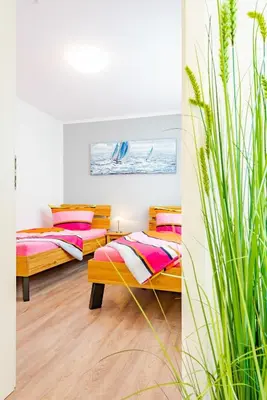Ein Bett oder Betten in einem Zimmer der Unterkunft Darßer Weg 31a