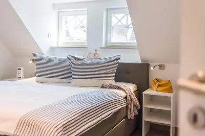 Ein Bett oder Betten in einem Zimmer der Unterkunft Friedensstr.20 A Wohnung 5