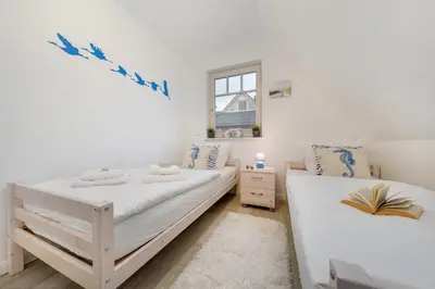 Ein Bett oder Betten in einem Zimmer der Unterkunft Villa Boddenluft