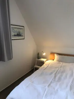 Ein Bett oder Betten in einem Zimmer der Unterkunft Friedensstraße 43 Wohnung 7