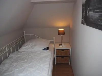Ein Bett oder Betten in einem Zimmer der Unterkunft Strandmuschel