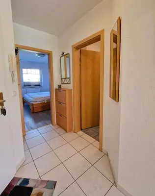 Ein Bett oder Betten in einem Zimmer der Unterkunft Friedensstraße. 43 Wohnung 2