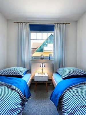 Ein Bett oder Betten in einem Zimmer der Unterkunft Friedenstr.43 Whg.6 Wellenläufer