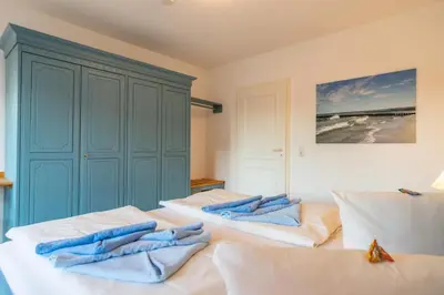Ein Bett oder Betten in einem Zimmer der Unterkunft Kurmittelcentrum Zingst