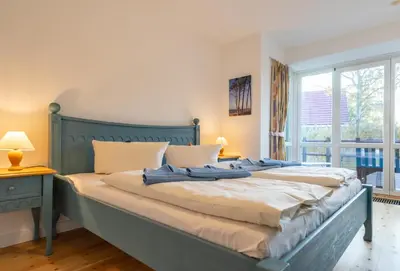 Ein Bett oder Betten in einem Zimmer der Unterkunft Kurmittelcentrum Zingst