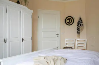Ein Bett oder Betten in einem Zimmer der Unterkunft Ferienhaus in Fuhlendorf mit Sauna
