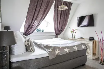 Ein Bett oder Betten in einem Zimmer der Unterkunft Luxusferienhaus in Fuhlendorf mit Sauna
