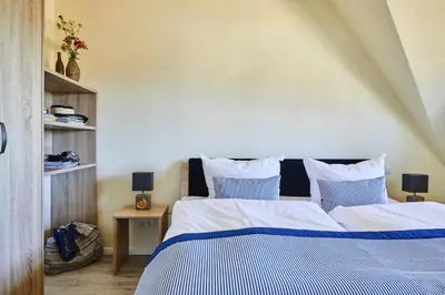 Ein Bett oder Betten in einem Zimmer der Unterkunft Premium-Ferienhaus in Fuhlendorf