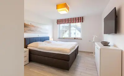 Ein Bett oder Betten in einem Zimmer der Unterkunft Seeigel