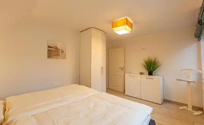 Ein Bett oder Betten in einem Zimmer der Unterkunft Seewolf