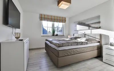 Ein Bett oder Betten in einem Zimmer der Unterkunft Seestern