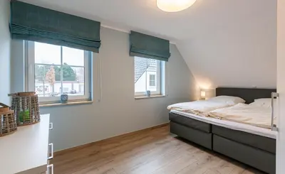 Ein Bett oder Betten in einem Zimmer der Unterkunft Seelöwe