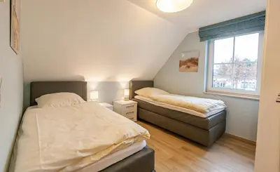 Ein Bett oder Betten in einem Zimmer der Unterkunft Seelöwe