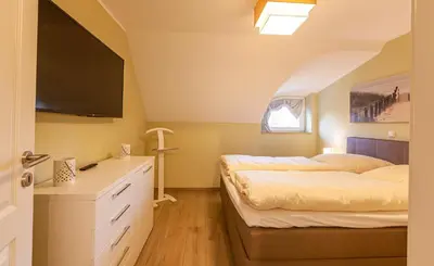Ein Bett oder Betten in einem Zimmer der Unterkunft Seemöwe