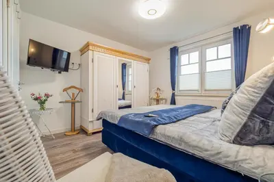 Ein Bett oder Betten in einem Zimmer der Unterkunft Fischländer 09