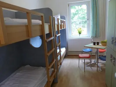 Ein Bett oder Betten in einem Zimmer der Unterkunft Bernsteinland Barth