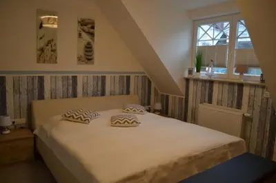 Ein Bett oder Betten in einem Zimmer der Unterkunft Friedenstraße 20B Whg.9 Classique