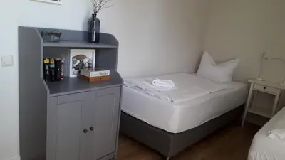 Ein Bett oder Betten in einem Zimmer der Unterkunft Ferienwohnung Born am Darßwald EG