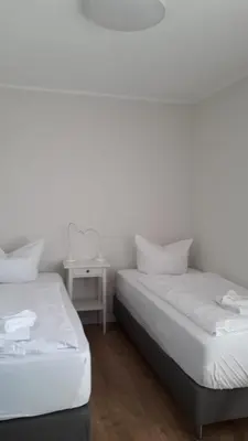 Ein Bett oder Betten in einem Zimmer der Unterkunft Ferienwohnung Born am Darßwald EG