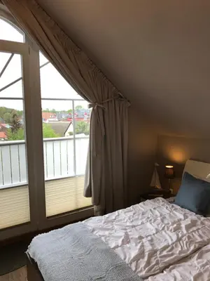 Ein Bett oder Betten in einem Zimmer der Unterkunft Penthouse Sonnenuhr