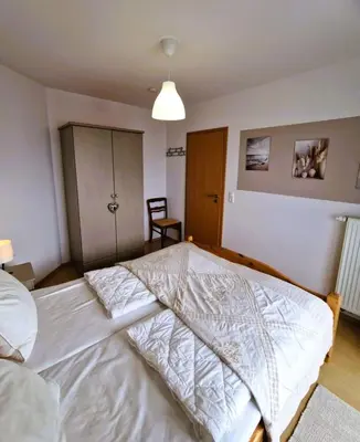 Ein Bett oder Betten in einem Zimmer der Unterkunft Fritz-Reuter-Str.