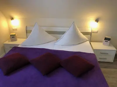 Ein Bett oder Betten in einem Zimmer der Unterkunft Gartenweg 3 Haus Maritimus 