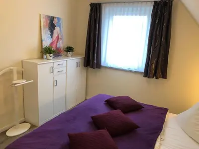 Ein Bett oder Betten in einem Zimmer der Unterkunft Gartenweg 3 Haus Maritimus 