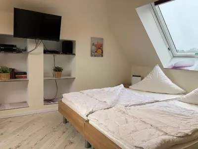 Ein Bett oder Betten in einem Zimmer der Unterkunft Gartenweg 3 Haus Maritimus 