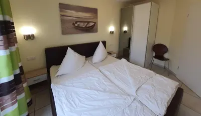 Ein Bett oder Betten in einem Zimmer der Unterkunft Gartenweg 3 Haus Maritimus Käptn's Perle