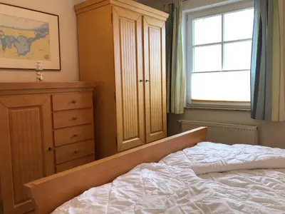 Ein Bett oder Betten in einem Zimmer der Unterkunft Glebbe 66 - Hus Sünnschien