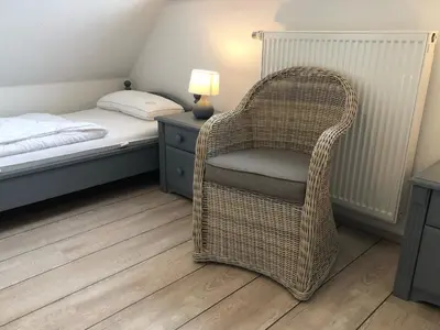 Ein Bett oder Betten in einem Zimmer der Unterkunft Glebbe 66 - Hus Sünnschien