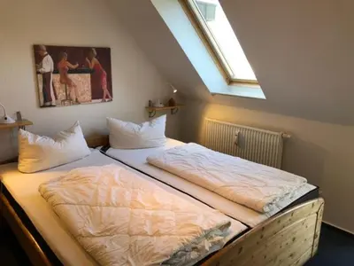 Ein Bett oder Betten in einem Zimmer der Unterkunft Hafenstr.22 A Wg.5