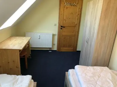 Ein Bett oder Betten in einem Zimmer der Unterkunft Hafenstr.22 A Wg.5