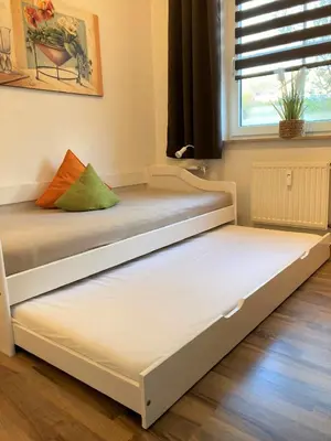 Ein Bett oder Betten in einem Zimmer der Unterkunft Birkenstr.14 a Whg.11