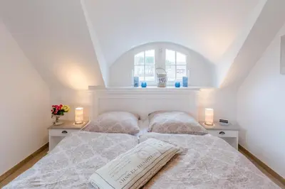 Ein Bett oder Betten in einem Zimmer der Unterkunft Haus Kranichsruh Whg. 