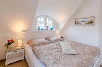 Ein Bett oder Betten in einem Zimmer der Unterkunft Haus Kranichsruh Whg. 