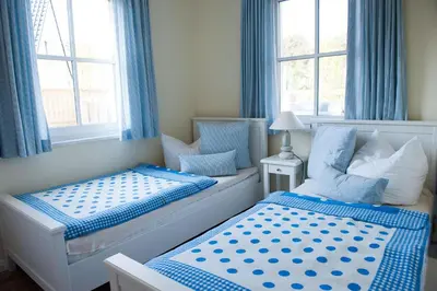 Ein Bett oder Betten in einem Zimmer der Unterkunft Haus Kranichsruh Wohnung 2.1 
