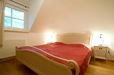Ein Bett oder Betten in einem Zimmer der Unterkunft Ferienhaus Zander mit Sauna